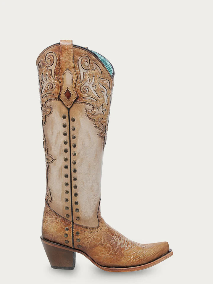 Side view of Corral C4218 women’s tall bone cowboy boot with honey leather overlays, embroidery, and metal studs on a 15-inch shaft