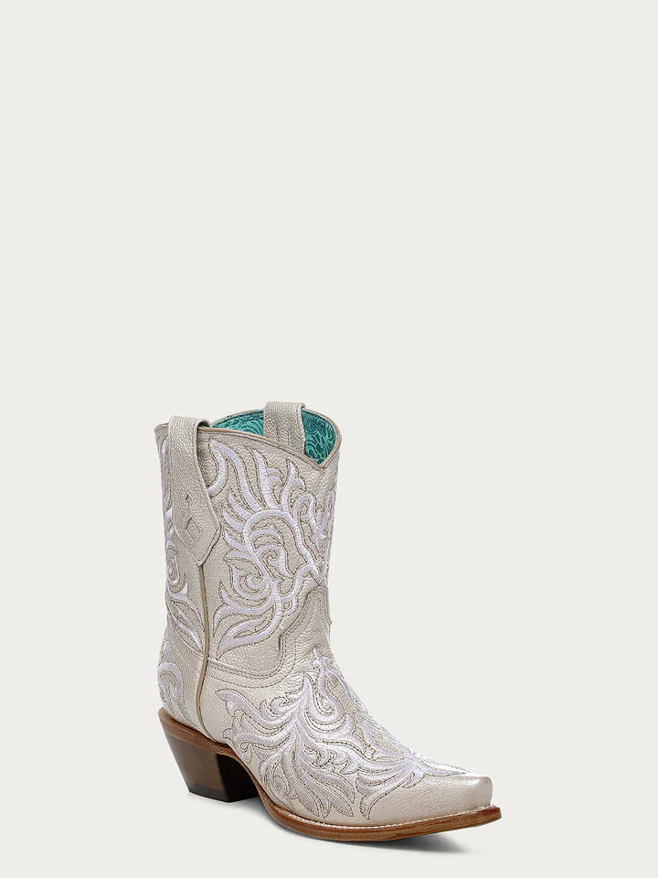 Angled view of Corral Z5344 women’s embroidered white leather ankle boot with snip toe and turquoise inner lining