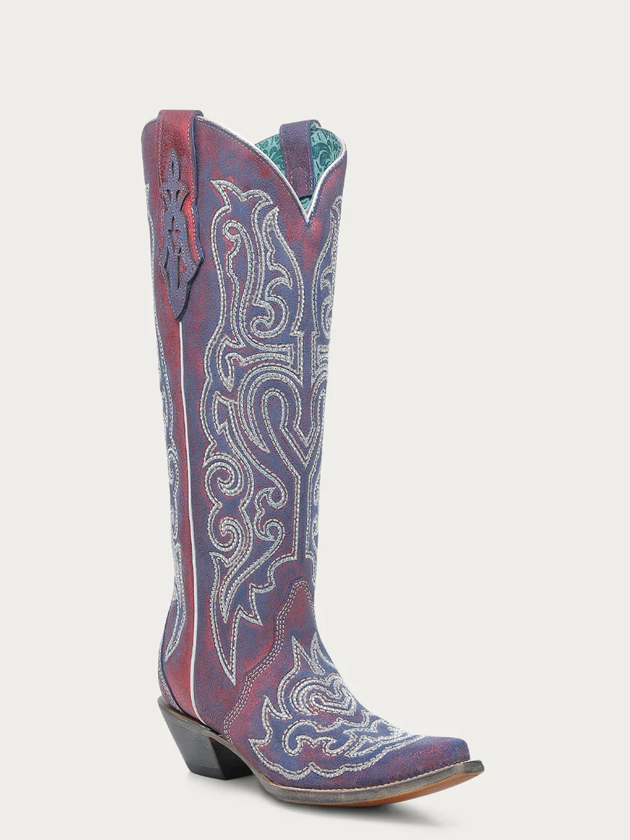 Decorative cowboy boot with intricate patterns on a white background